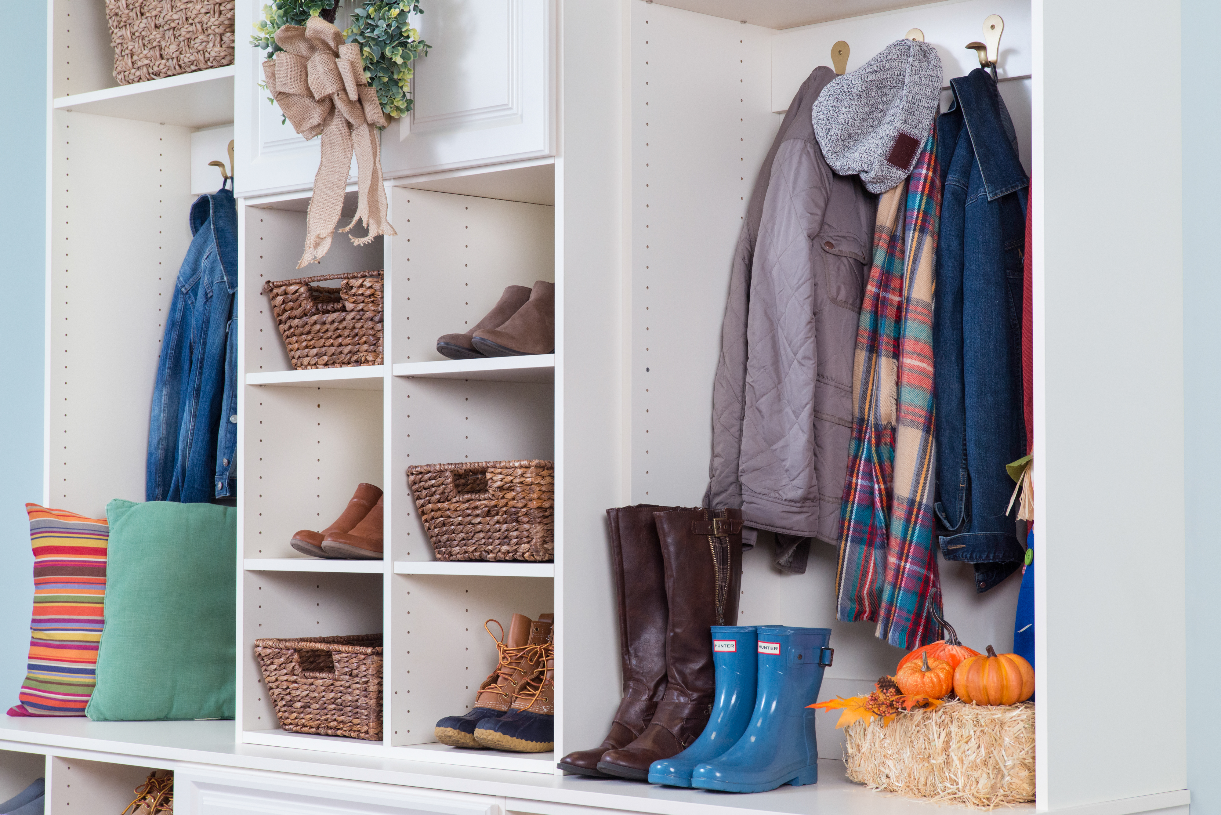 Classica Mudroom in Bisque with shoes, coats, scarves, and fall décor. 