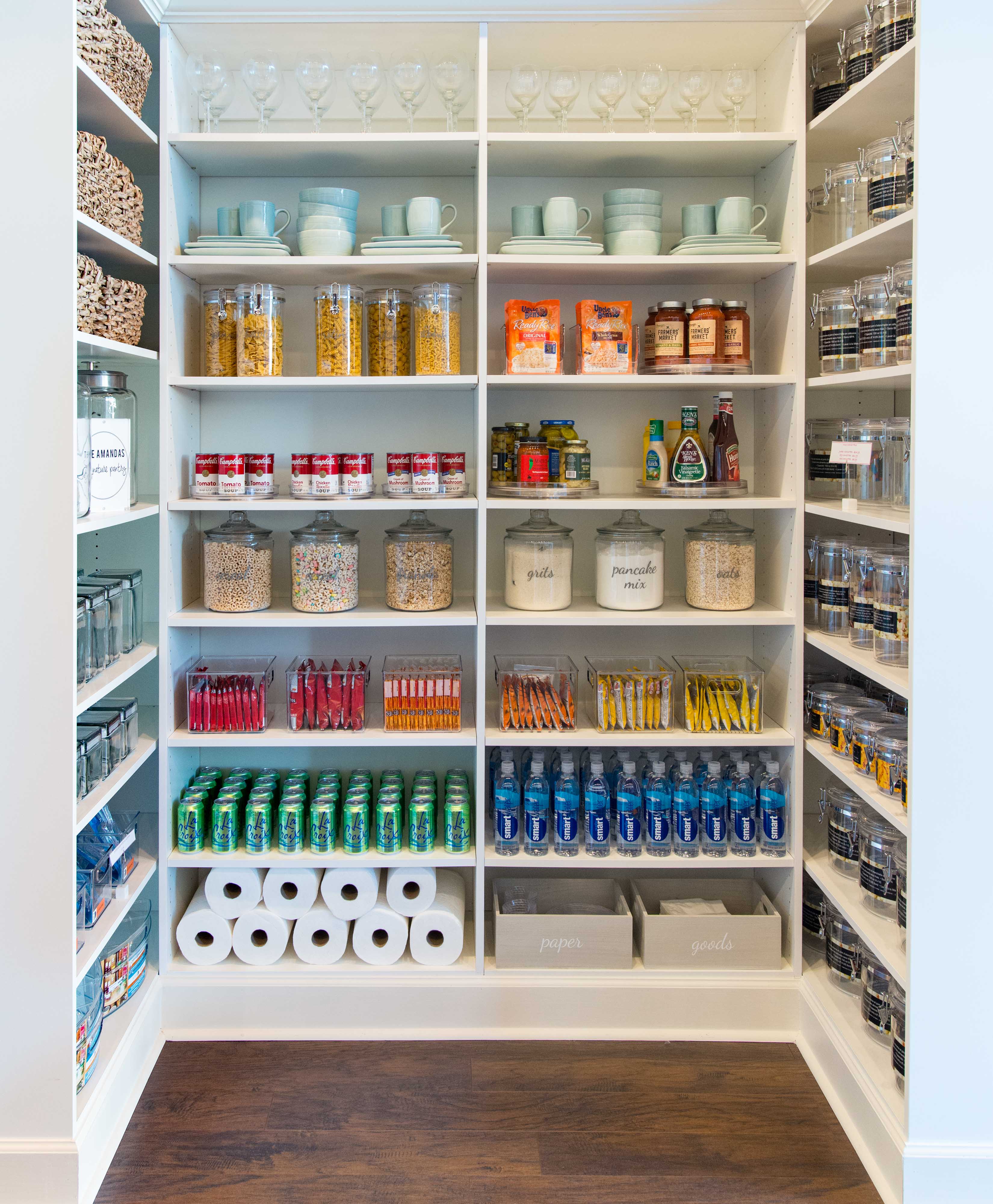 Classica Pantry in White with organized drinks and snacks.