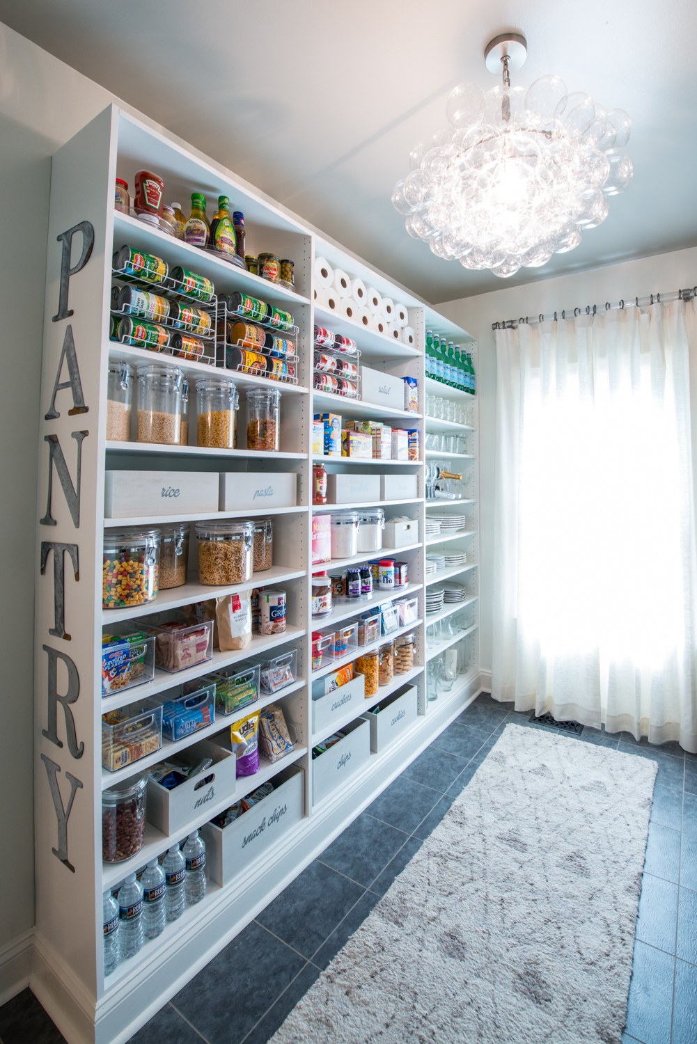 Classica Pantry with organized canned goods and drinks.