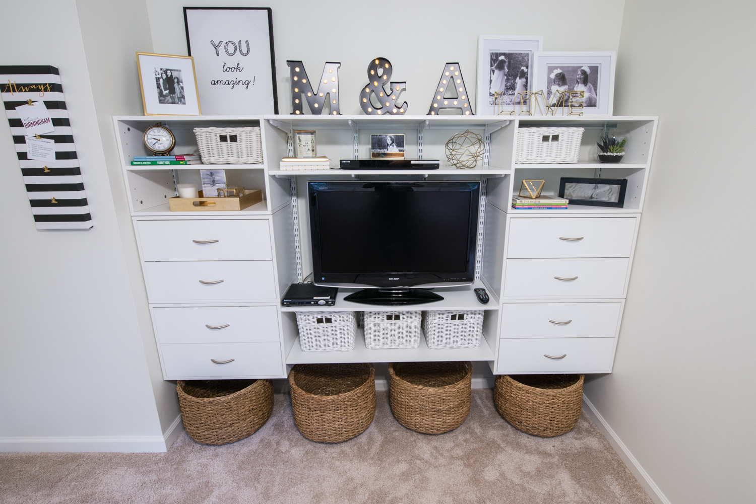 freedomRail Built-in in White with TV and baskets.