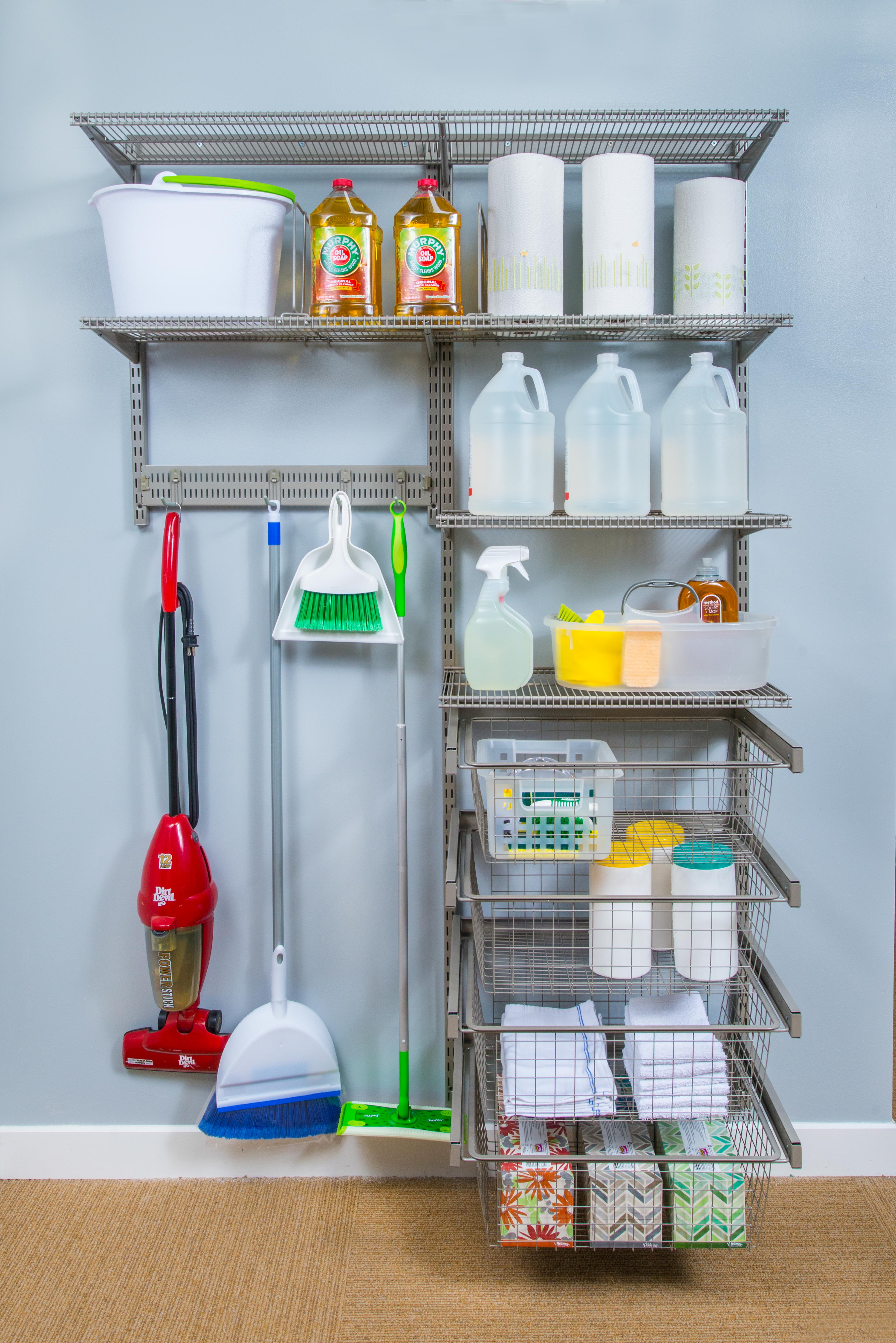 freedomRail Cleaning Storage Solution with cleaners, vacuum, broom and paper towels.