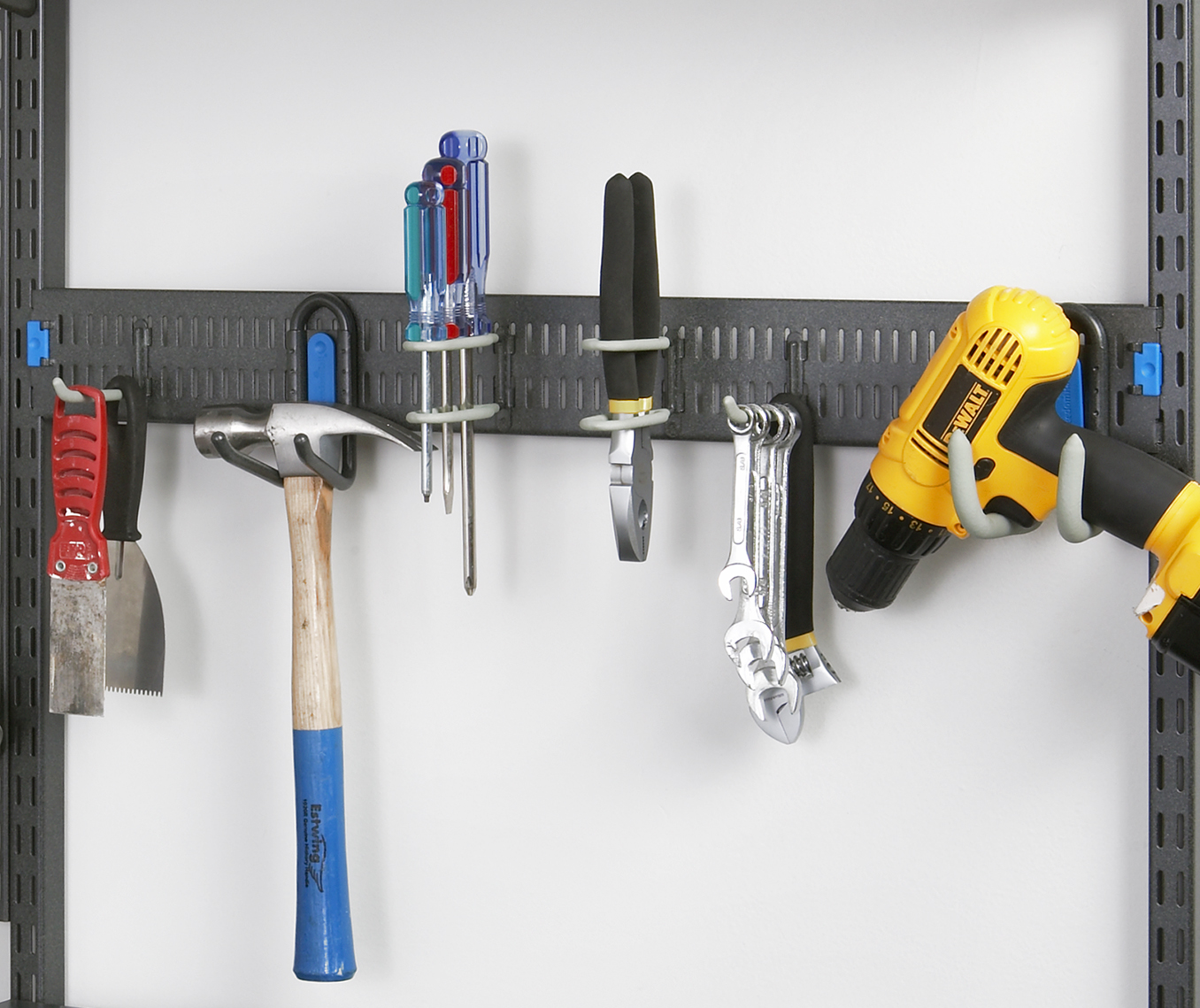 freedomRail Garage with Spanner holding tools, hammer, and DeWalt drill.