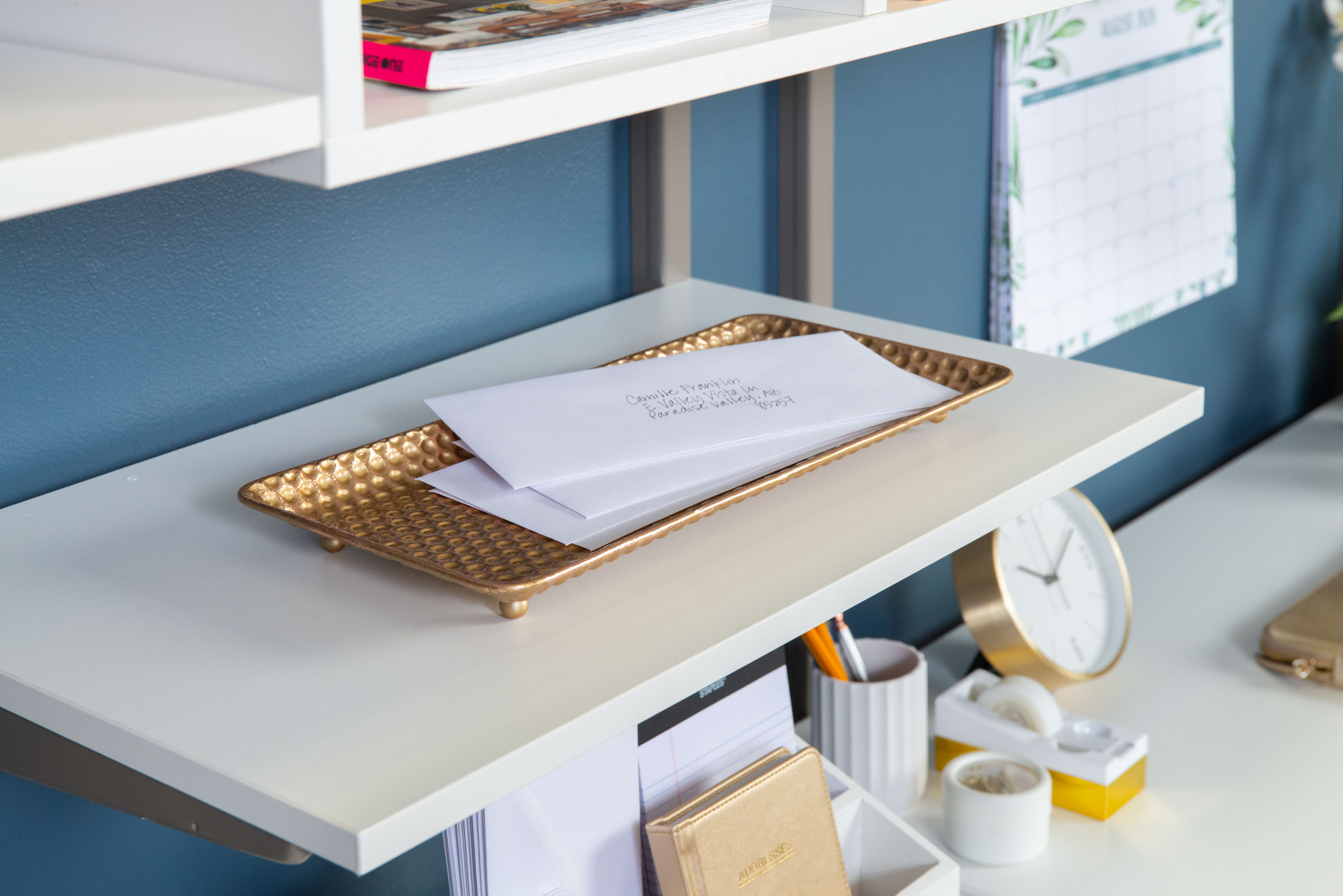 freedomRail Office Desk in White with mail and office supplies.