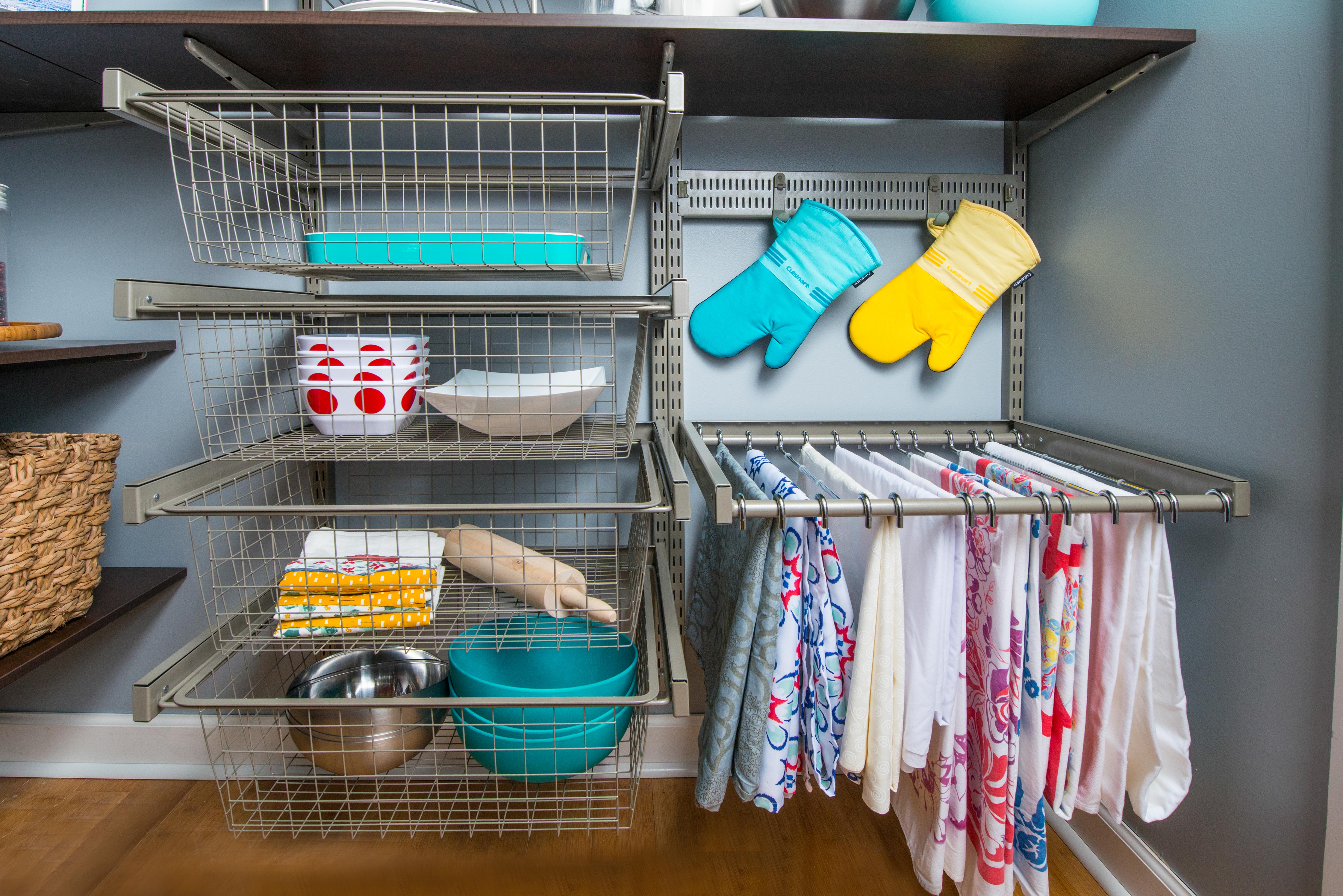 freedomRail Pantry in Chocolate Pear and Nickel with kitchen utensils and blue background.