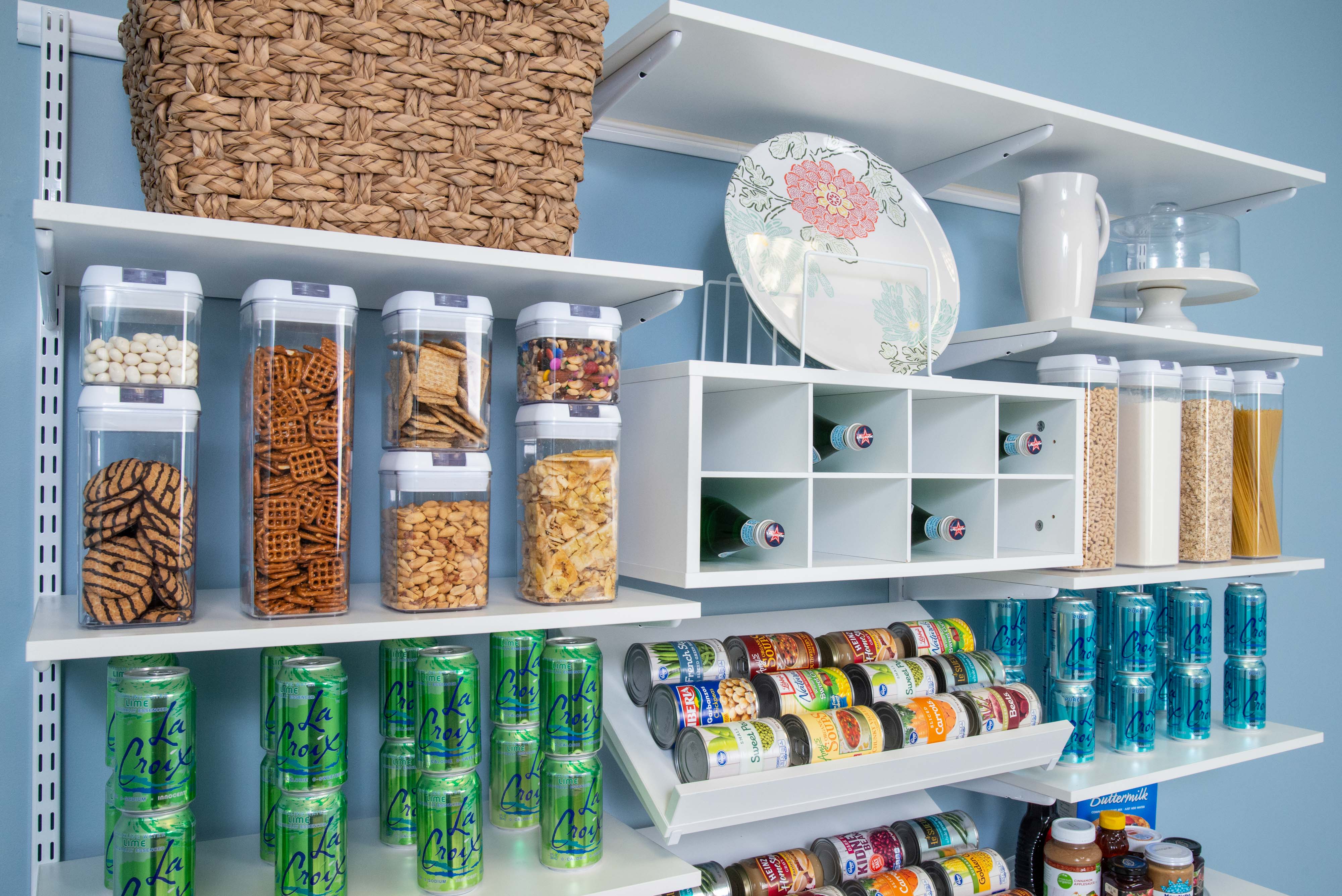 freedomRail Pantry in White with La Croix's, canned goods and clear containers full of food.