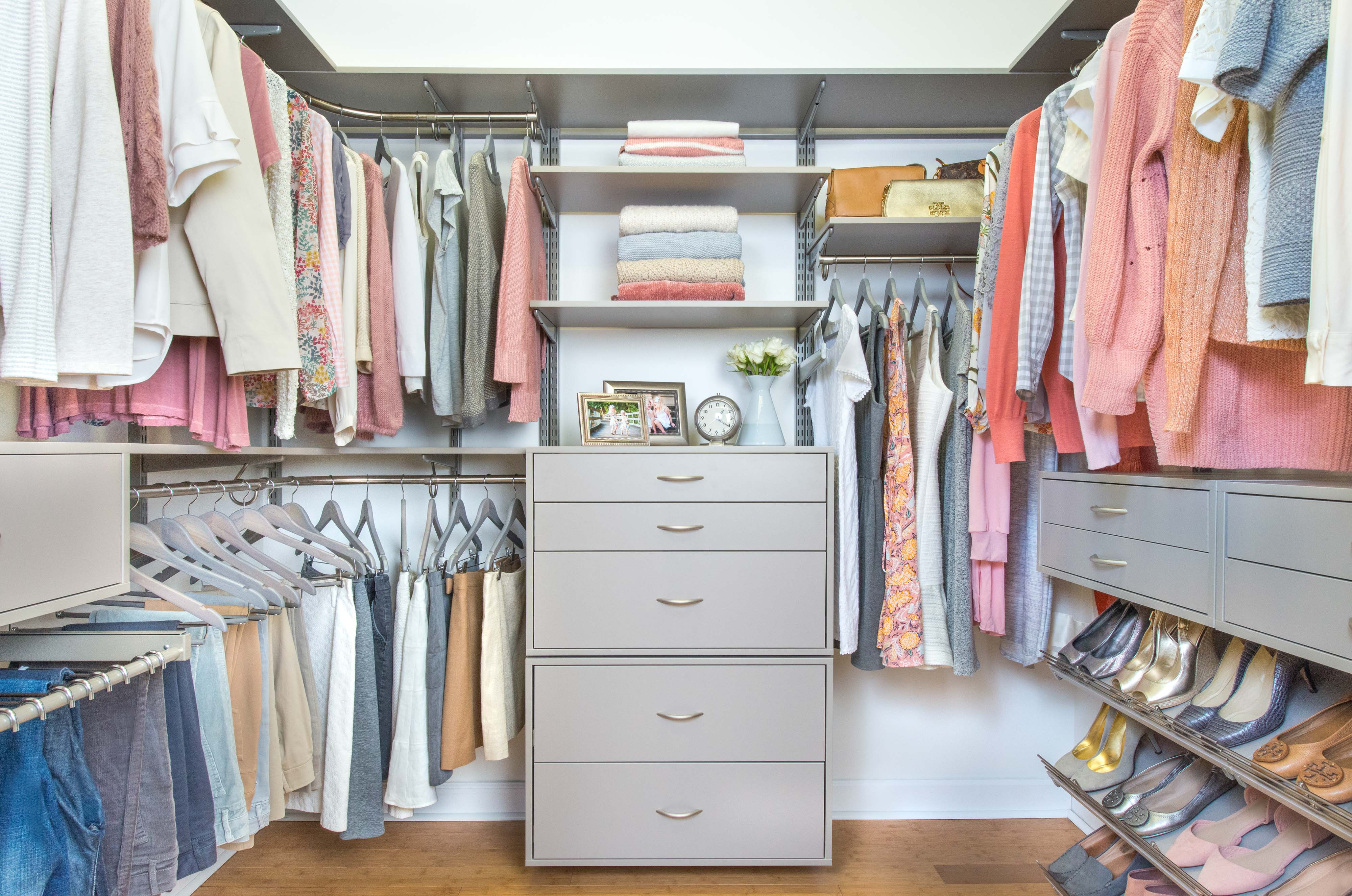 freedomRail Walk-in Closet in Century Gray with women's clothing and accessories.