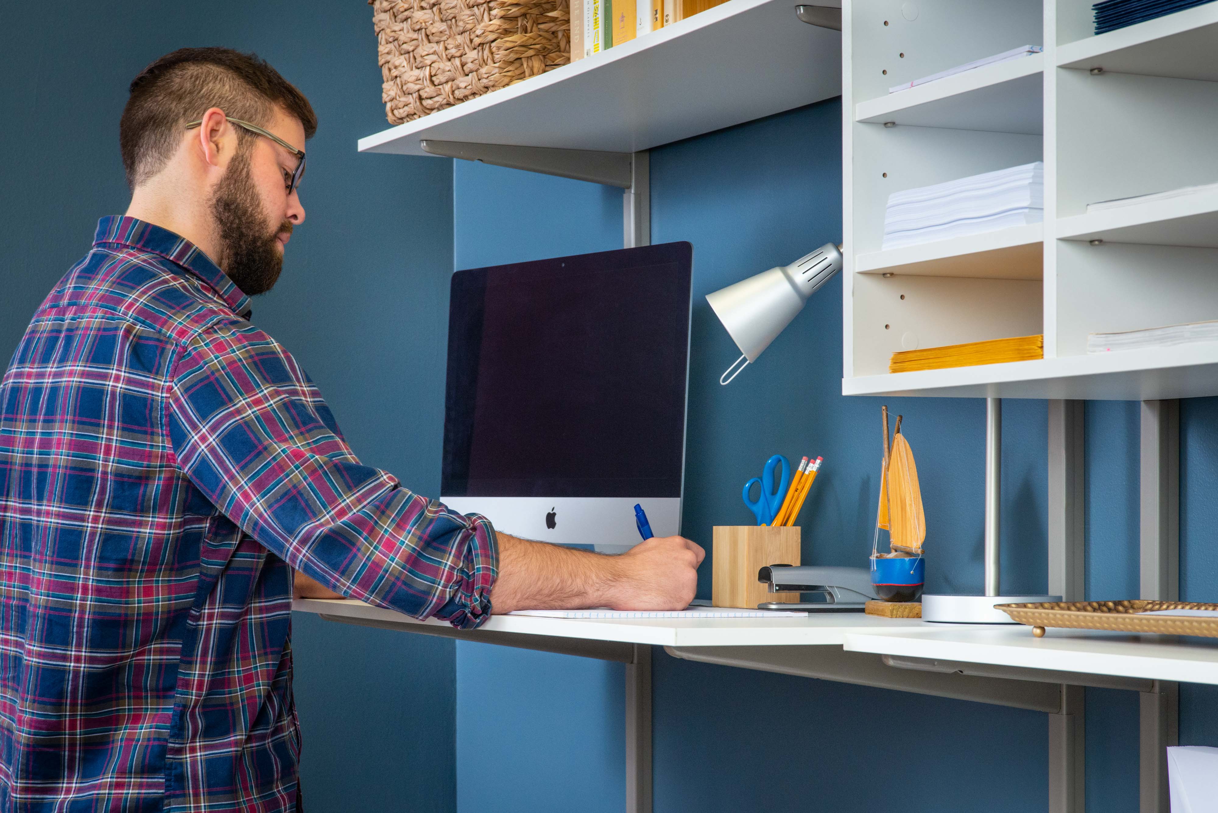 freedomRail White Dual Desk Office with man and desktop.