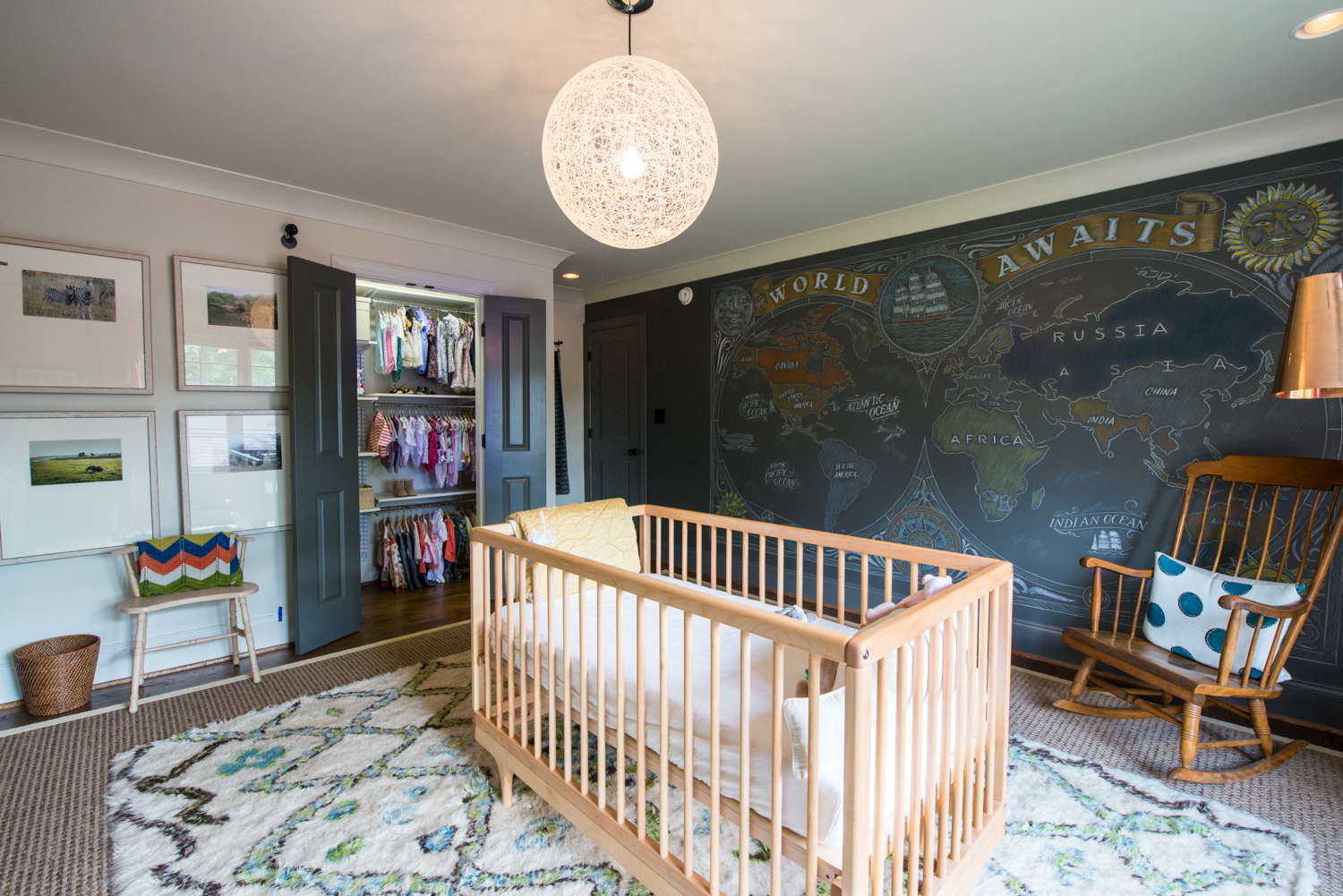 Alabama Nursery with wooden crib and chalkboard wall.