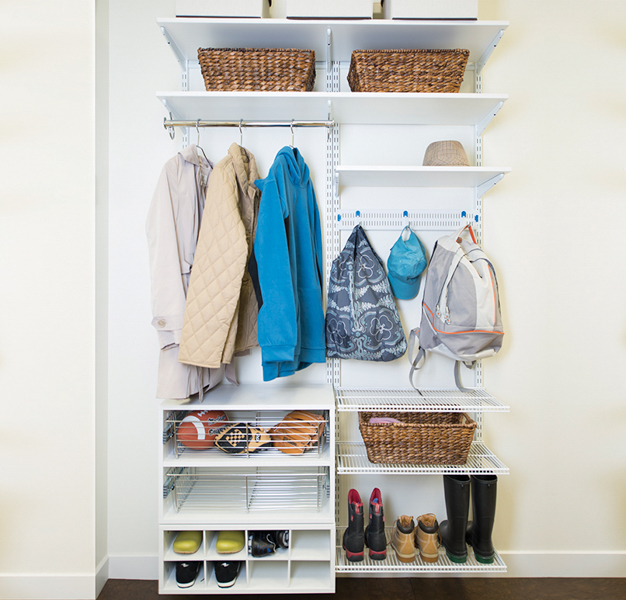 freedomRail mudroom shelving with coats and bags.