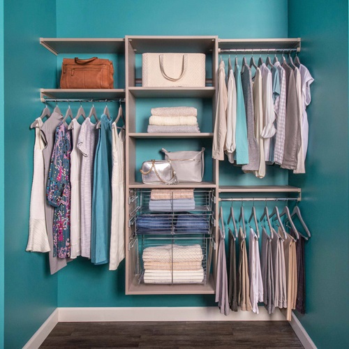 VUE Reach-In Closet in Century Gray with clothes, sweaters, hangers, with blue wall.